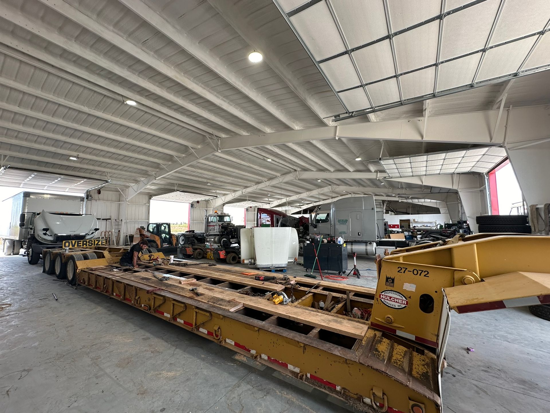 A wooden table with a bunch of metal parts on it
