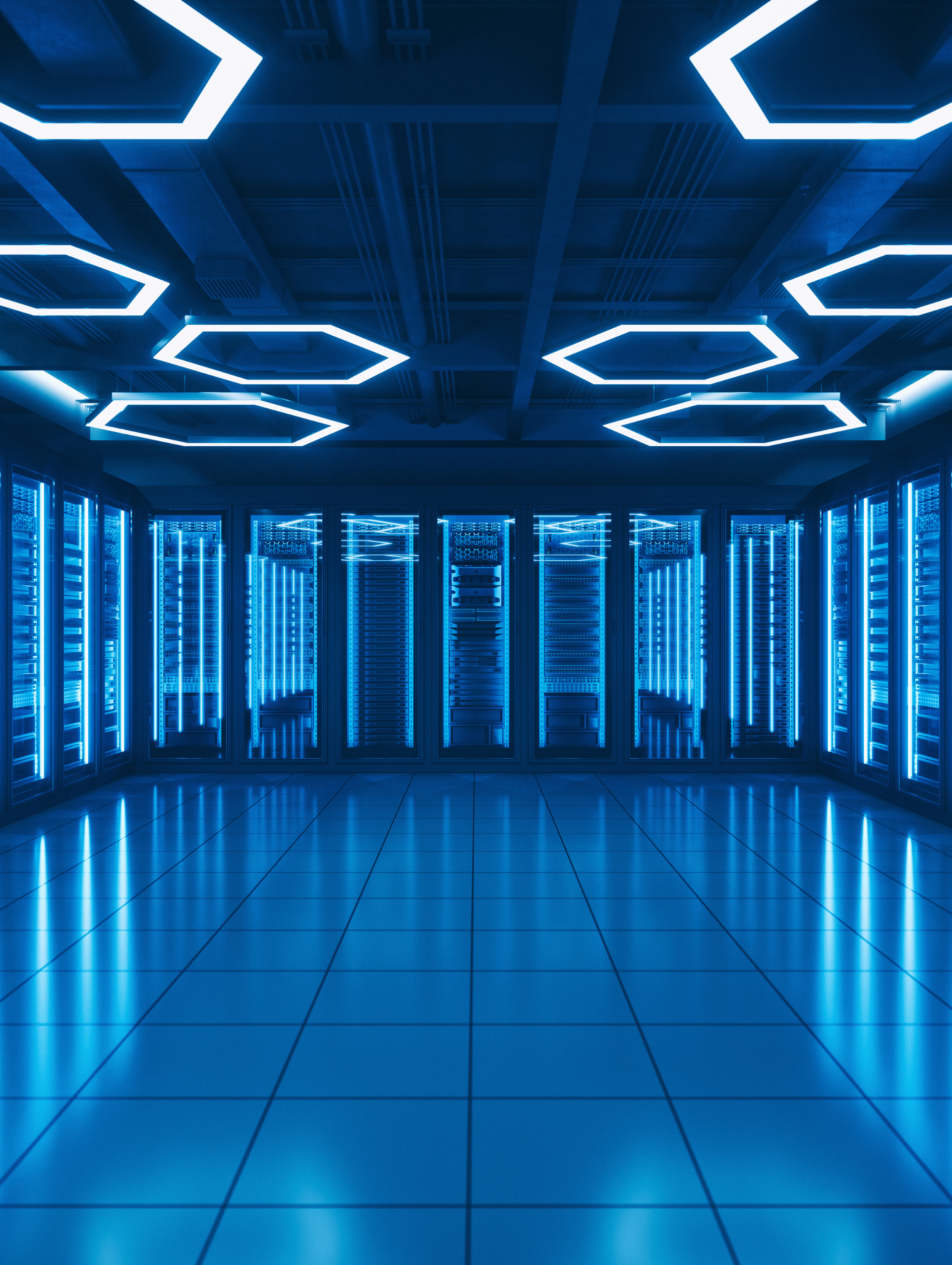 A room with a lot of servers and lights on the ceiling.