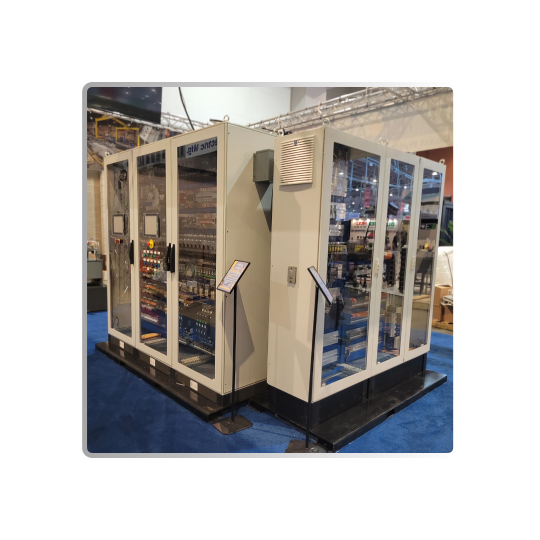 A large electrical cabinet for motor controls is sitting on top of a blue carpet.