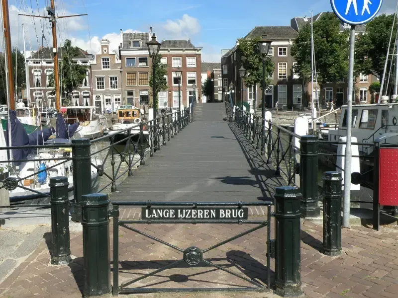 a bridge with a sign that says lange ijzeren brug