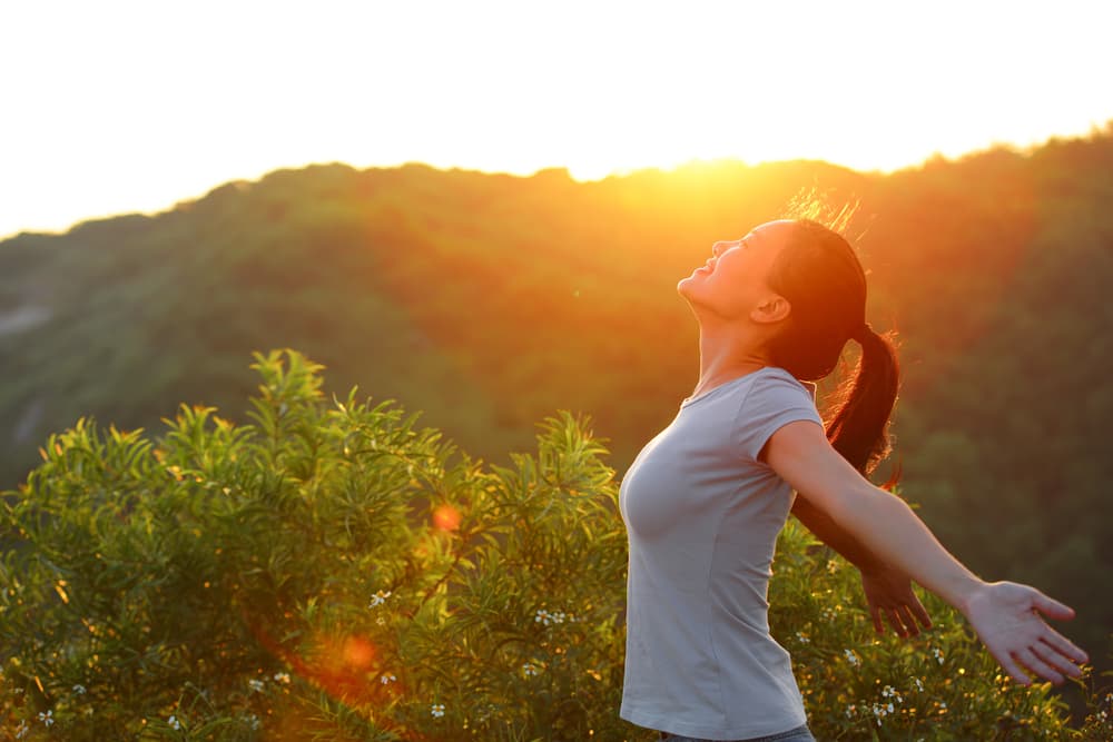 Woman with Open Arms at Sunrise - Health & Wellness In Shell Cove, NSW