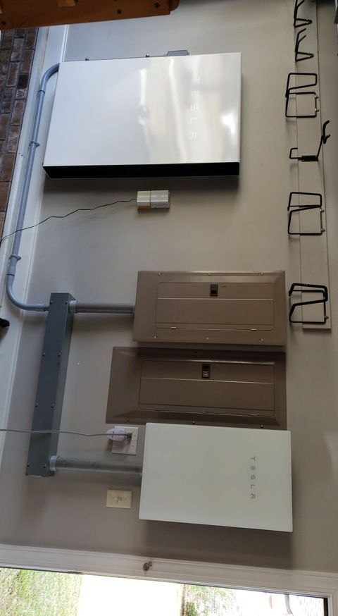 A room with a lot of electrical equipment on the wall.