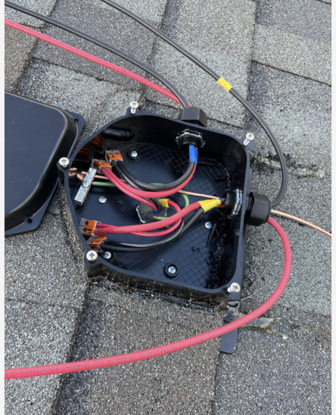 A black box with a bunch of wires inside of it