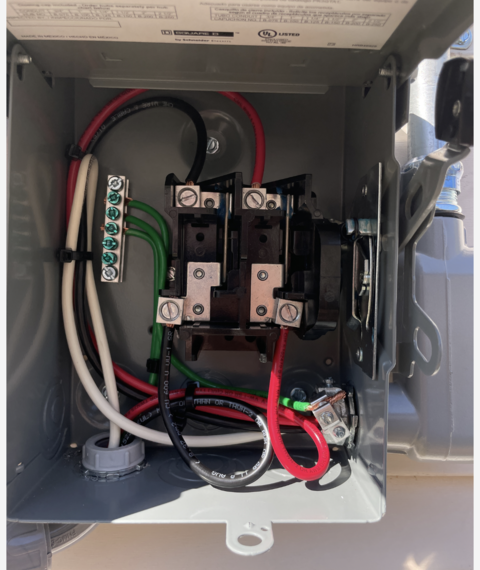 A box with a lot of wires inside of it