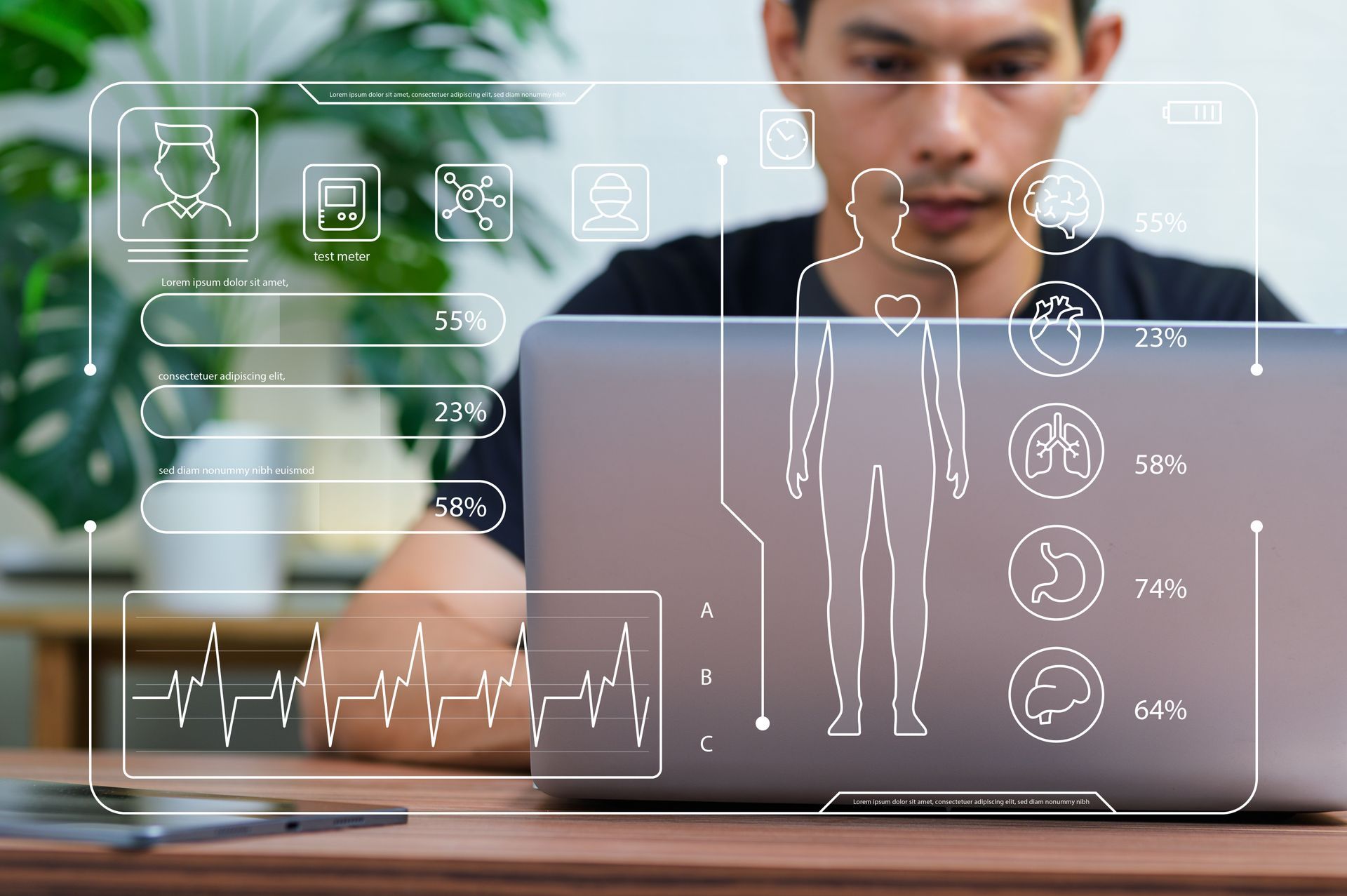 Man using a laptop with translucent fitness data overlays in a bright home office