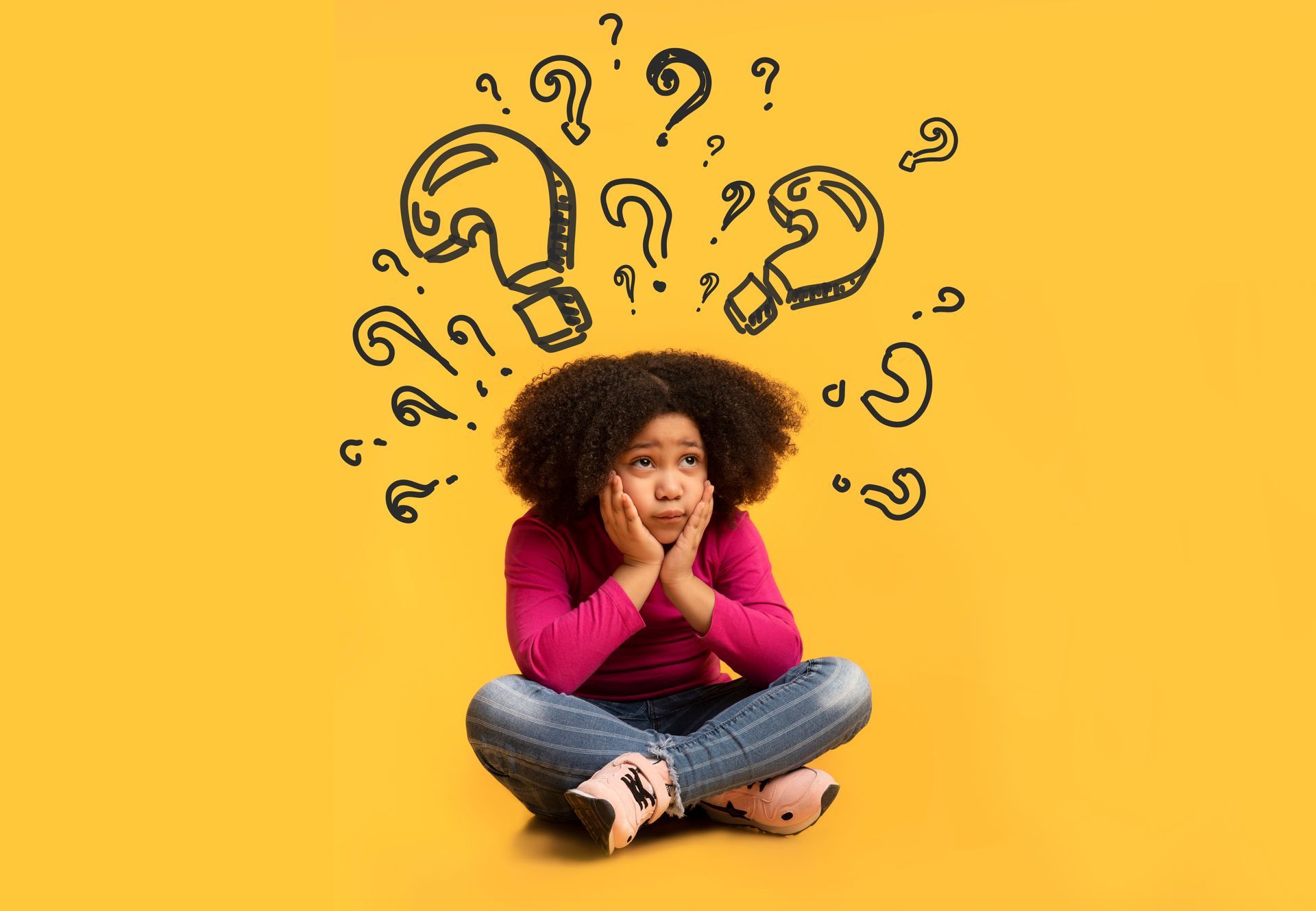 Person sitting cross-legged on a yellow background, surrounded by floating question marks, looking thoughtful