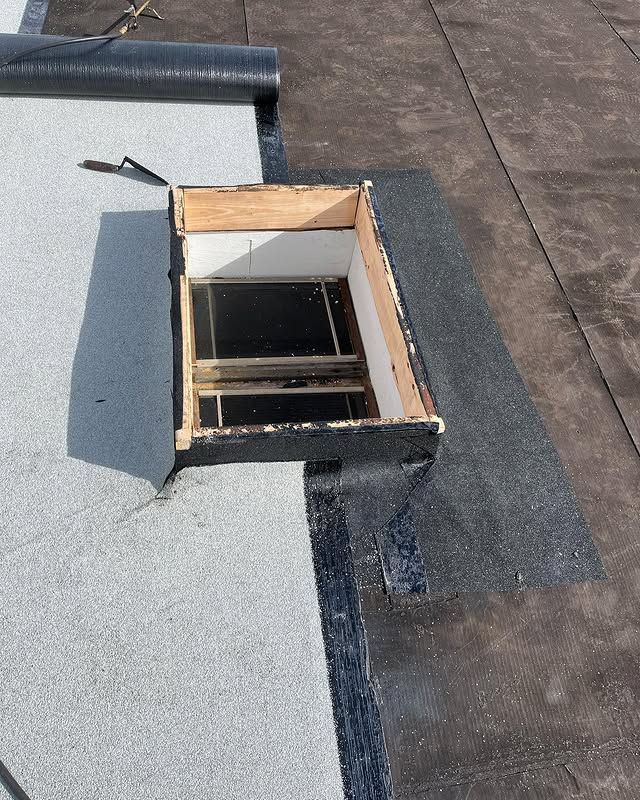 A roof with a hole in it that looks like a window