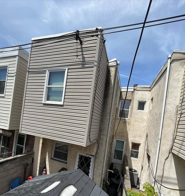 A building with a lot of wires hanging from it