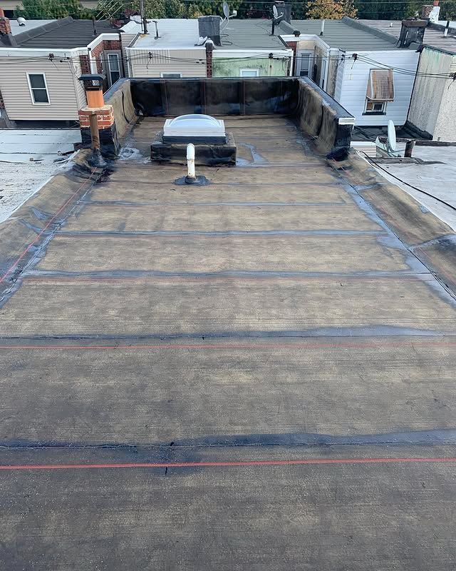 A roof with a skylight on top of it.