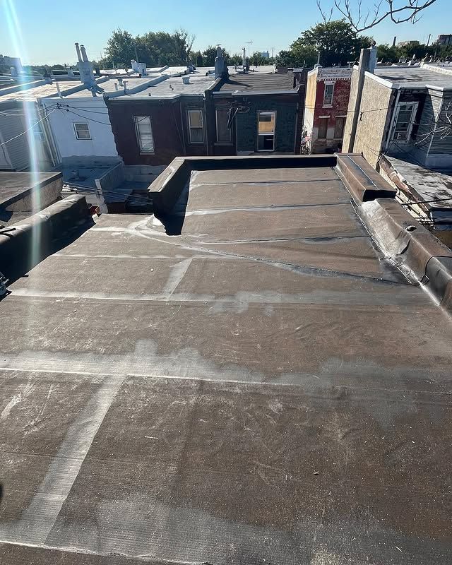 A roof with a lot of buildings in the background