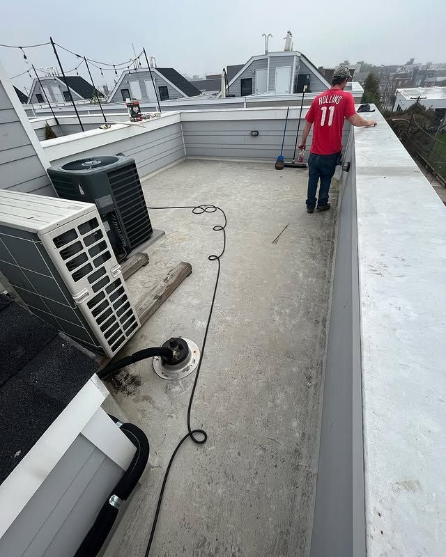 A man wearing a red shirt with the number 11 on it