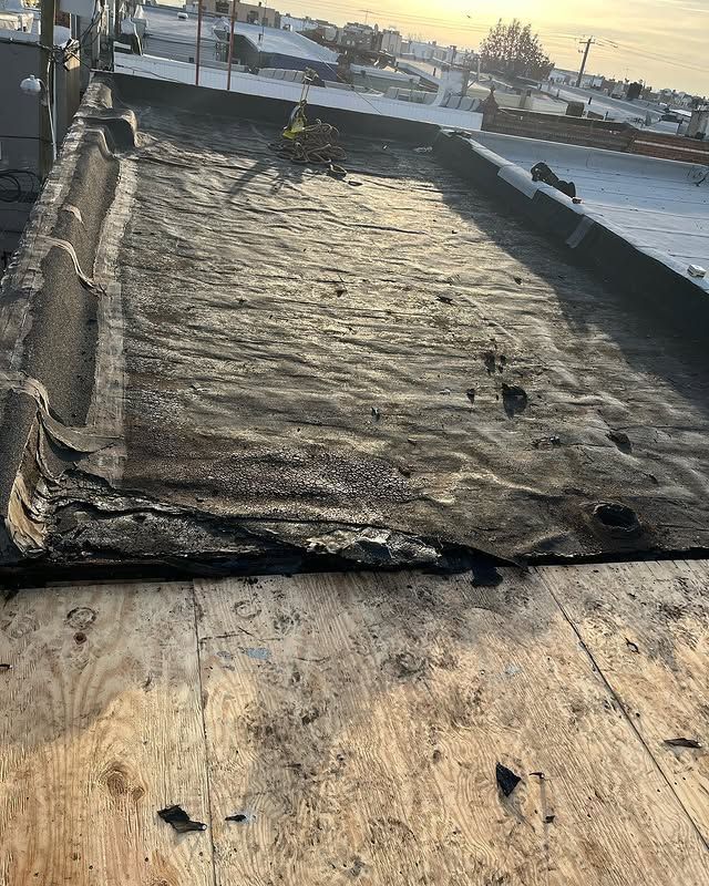 A close up of a roof with a lot of damage on it.
