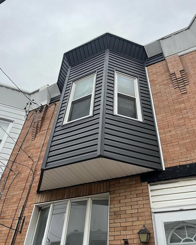 A brick building with a balcony on the side of it.