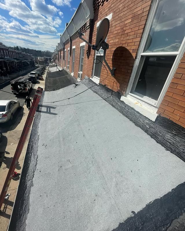 A brick building with a satellite dish on the side of it.