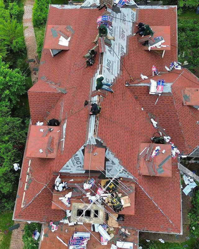 An aerial view of a roof that is being repaired