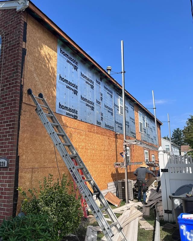 A ladder is leaning against the side of a building.