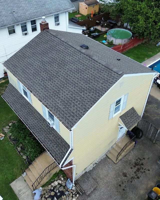 An aerial view of a house with a new roof