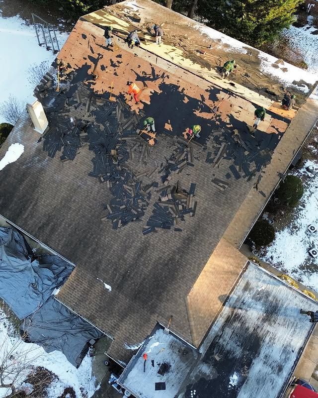 An aerial view of a roof that is being repaired