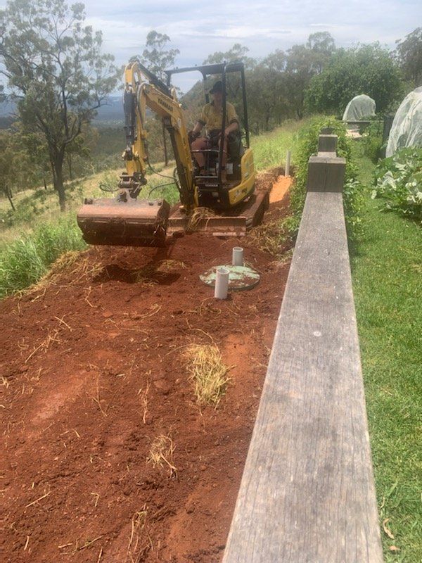 Stormwater drainage installation - excavator hard at work