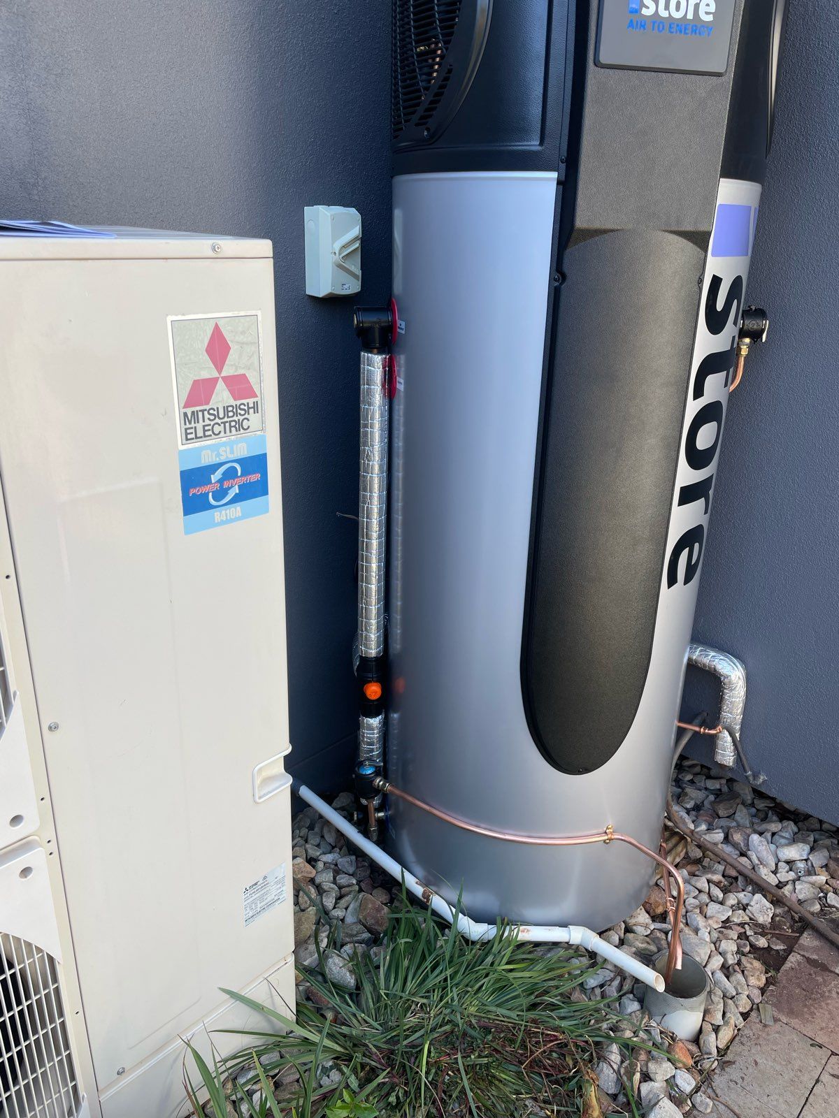 A picture of a newly installed IStore heat pump hot water system.