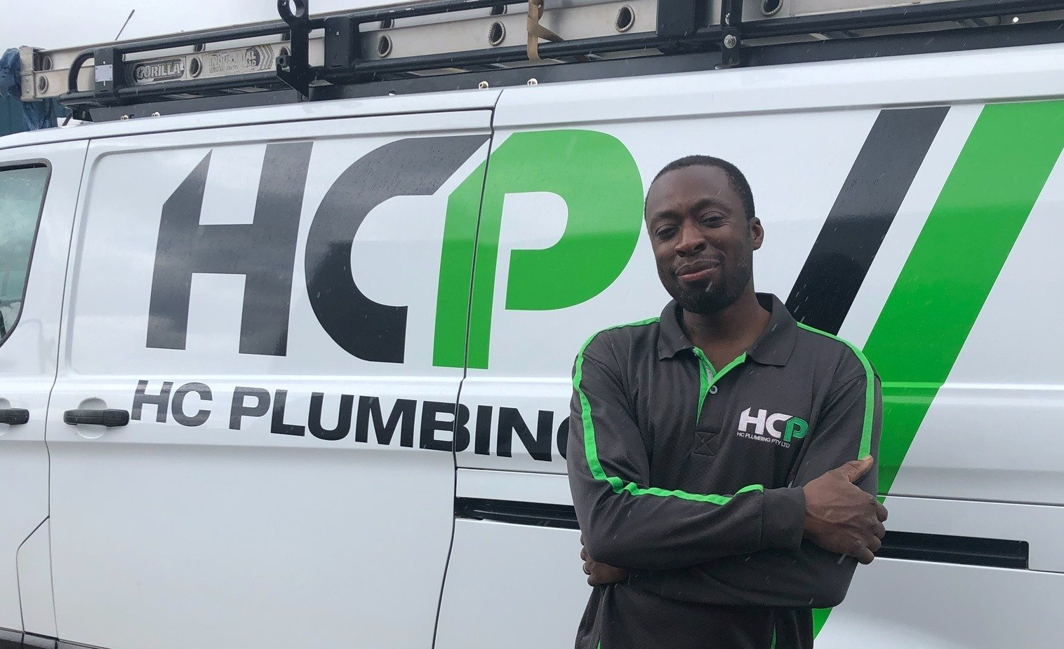 Lou, a qualified HC Plumbing plumber, standing beside his HC Plumbing van.