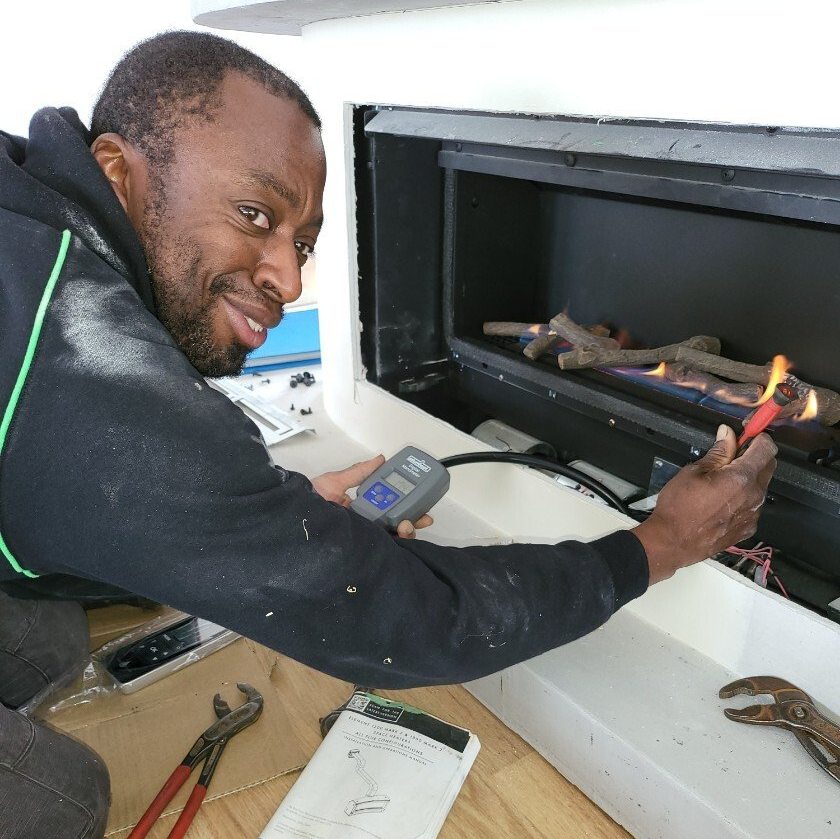 Lou, installing a new gas fireplace.