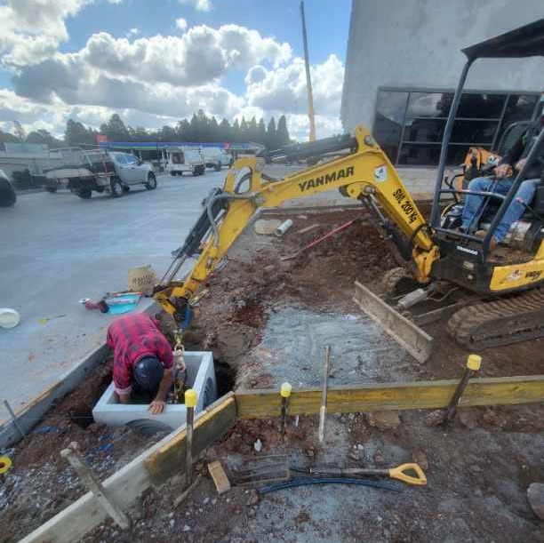 Installing stormwater pits at a commercial job.