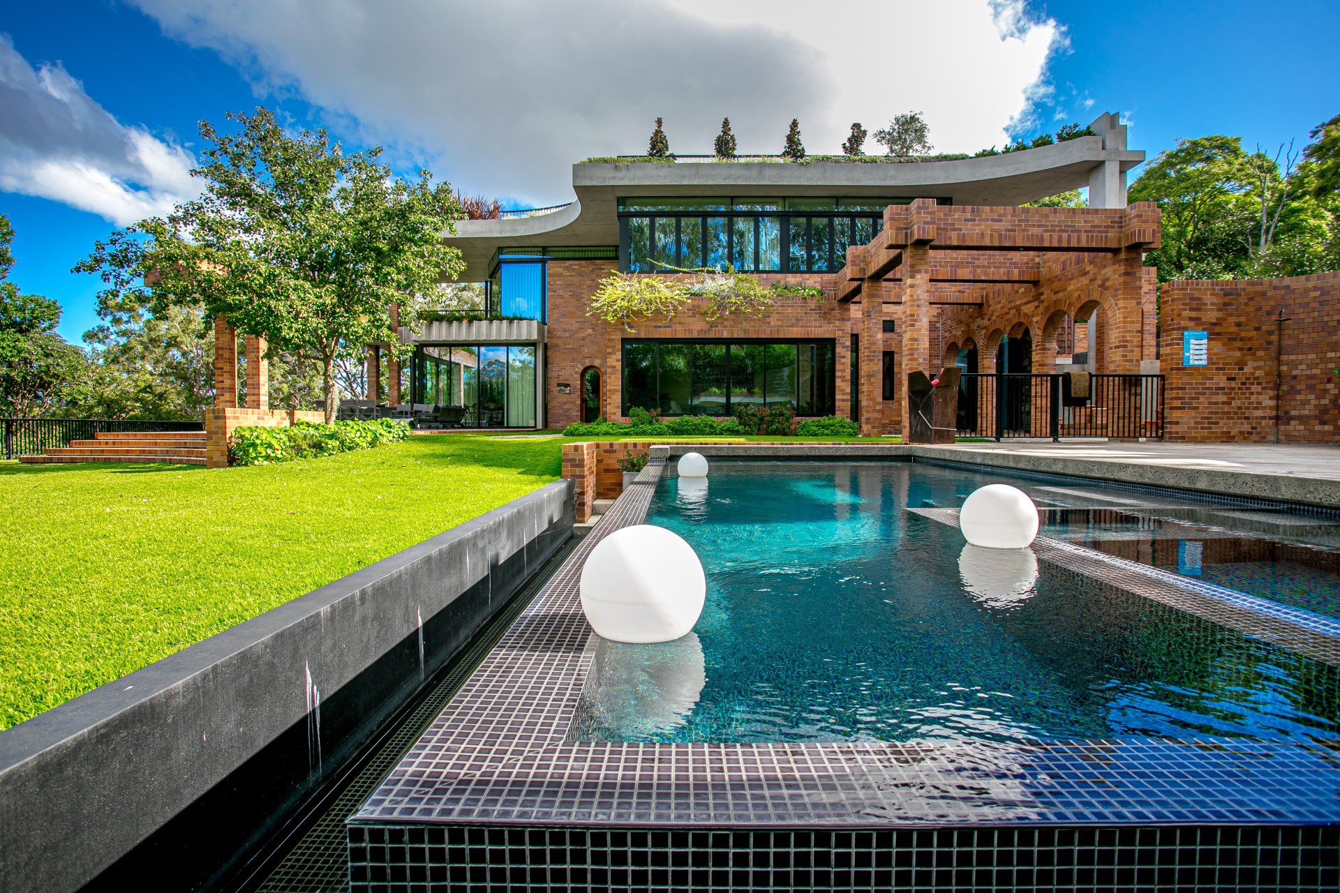 Image of a large new two story home with a swimming pool