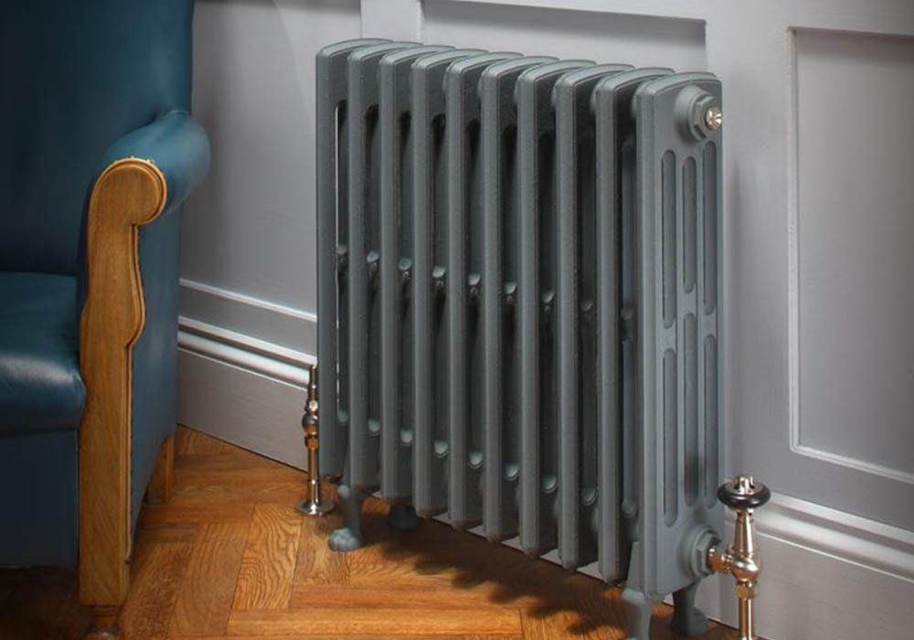 Picture of a traditional radiator panel in a lounge room.