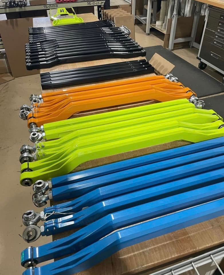 A bunch of different colored arms are sitting on a table.