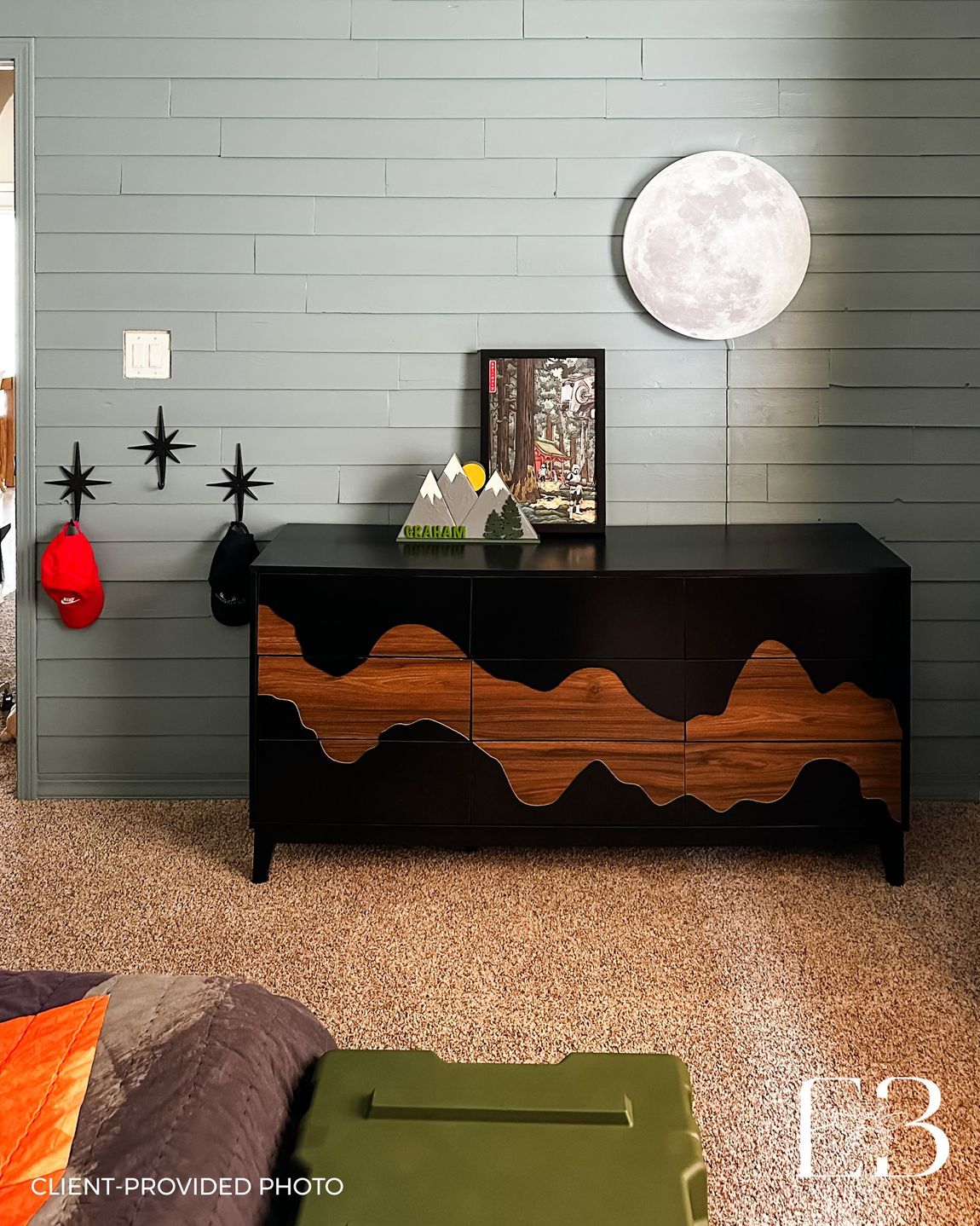 Boys’ bedroom with muted blue shiplap wall, moon light, and mountain-inspired dresser by Emerald Bee Interiors.