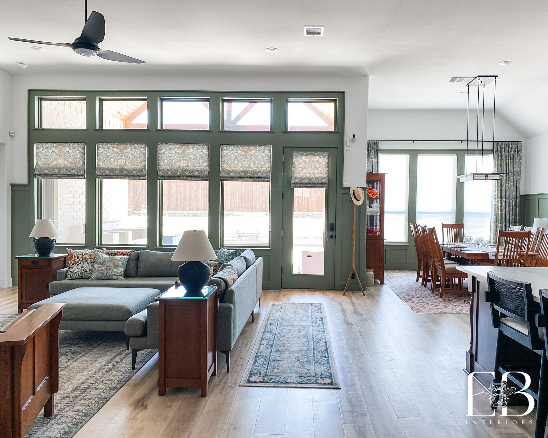 Devotion Row great room open concept continuous flooring custom millwork by Emerald Bee Interiors