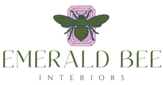Emerald Bee Interiors logo featuring an emerald-green bee centered over a purple emerald-cut gemstone — a creative twist that blends the unexpected pairing of gemstone and insect to symbolize balance between structure and artistry.