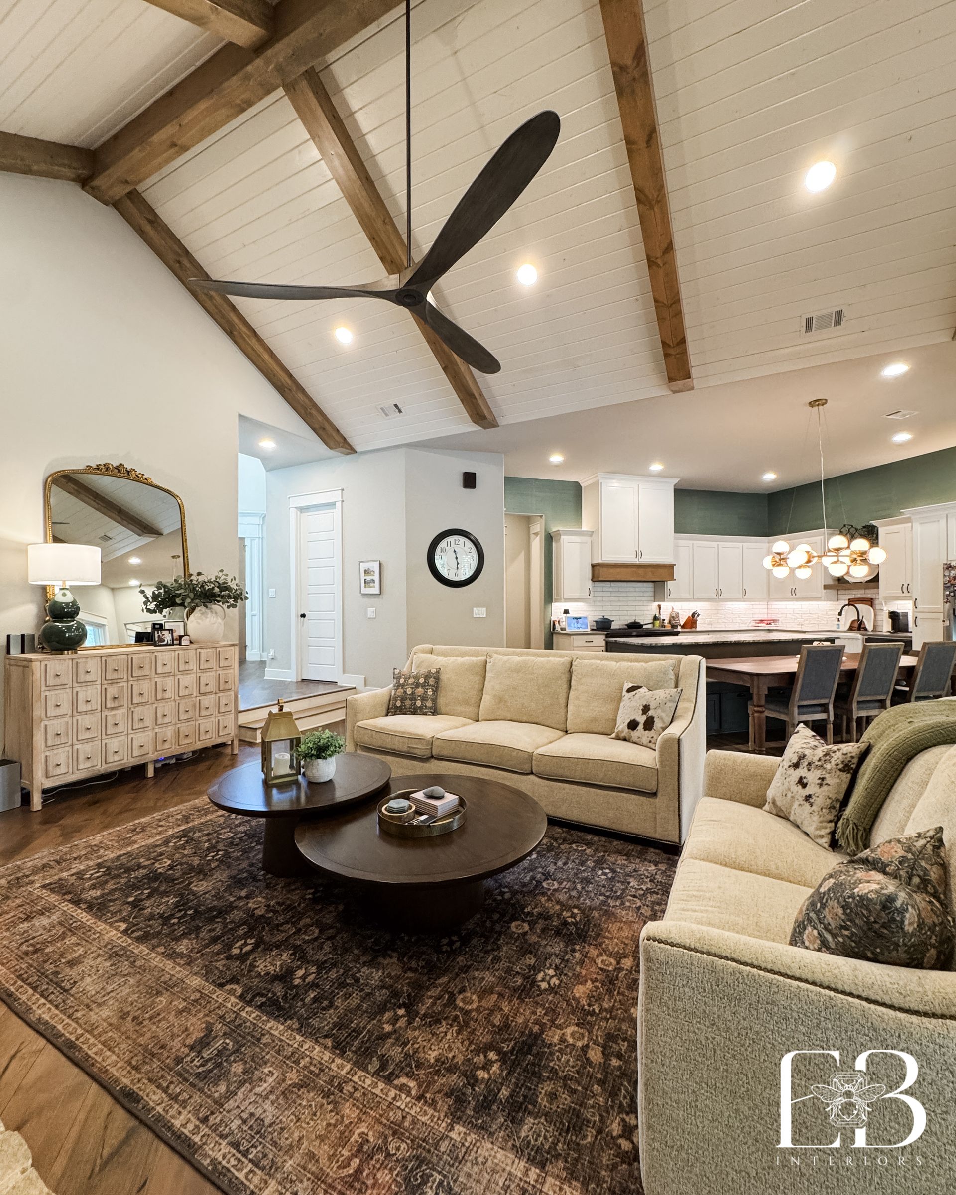 Devotion Row vignette with floral cabinet, green paneling, and Mission-style furniture by Emerald Bee Interiors.