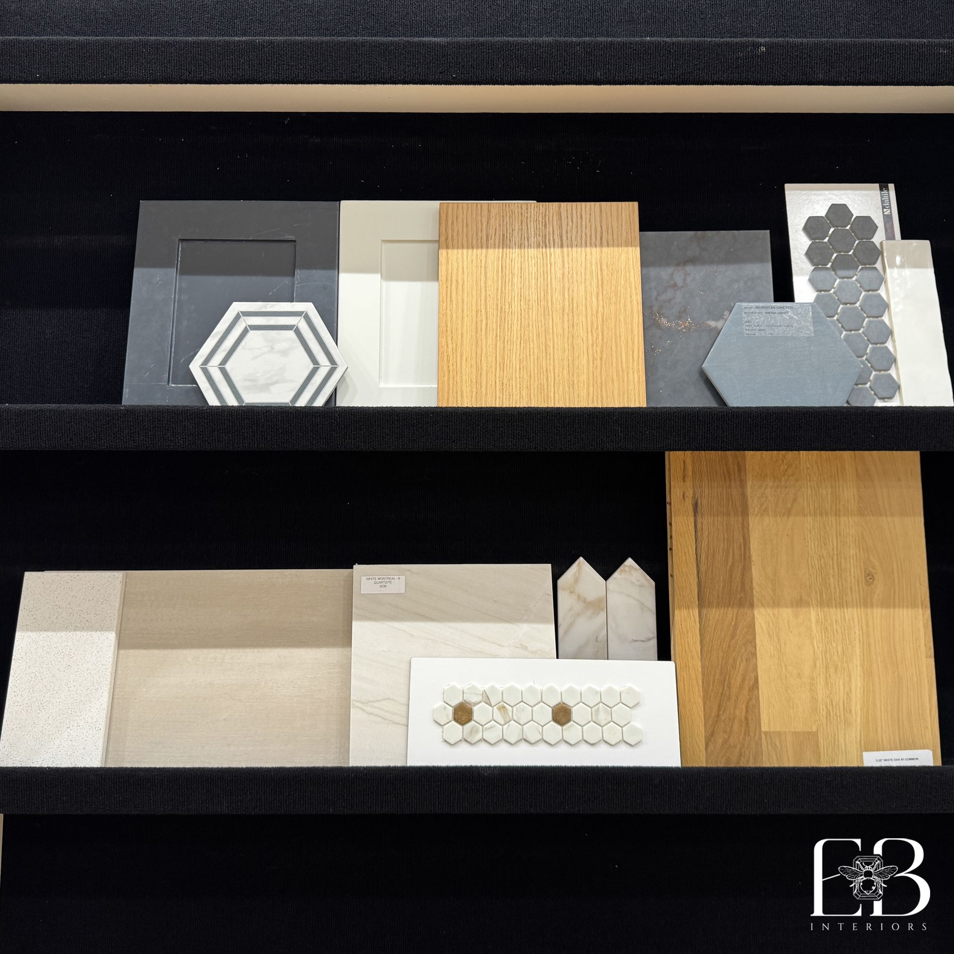 Shelves displaying home design samples: paint, wood, and tile in neutral tones.