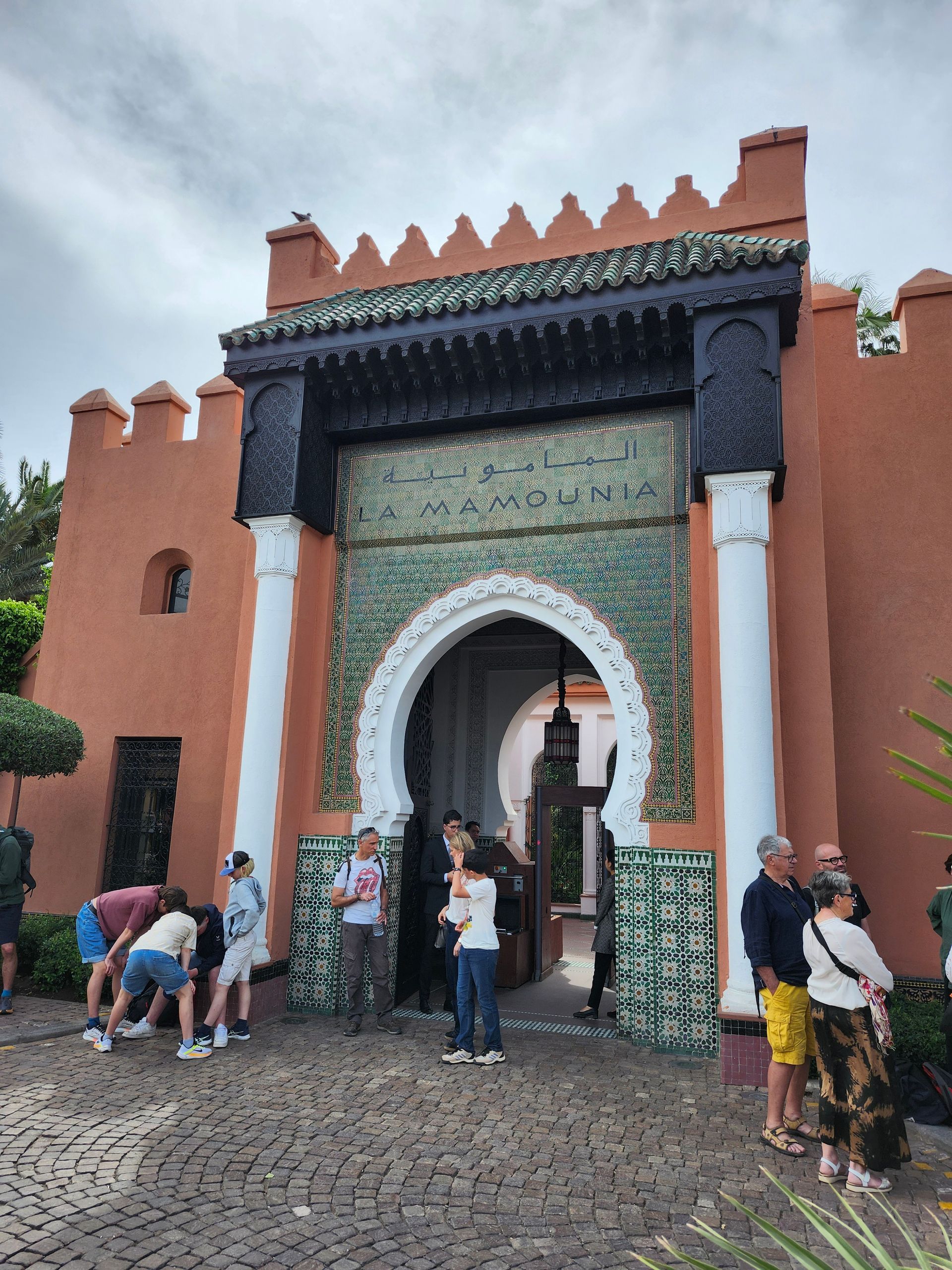 A group of people are standing in front of a building