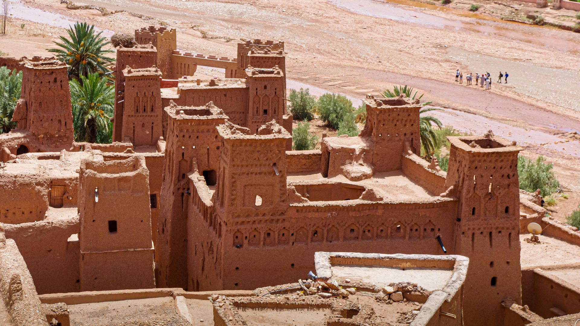 An aerial view of a castle in the middle of the desert