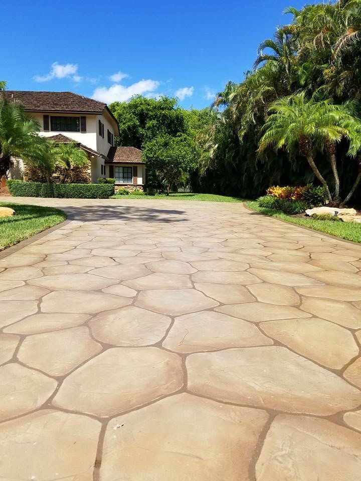 Our crew spreading concrete for a sidewalk