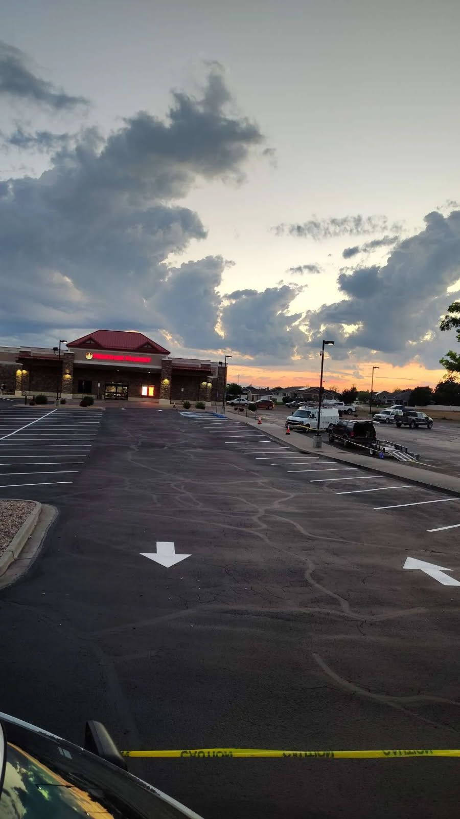 A white arrow is painted on the side of a road