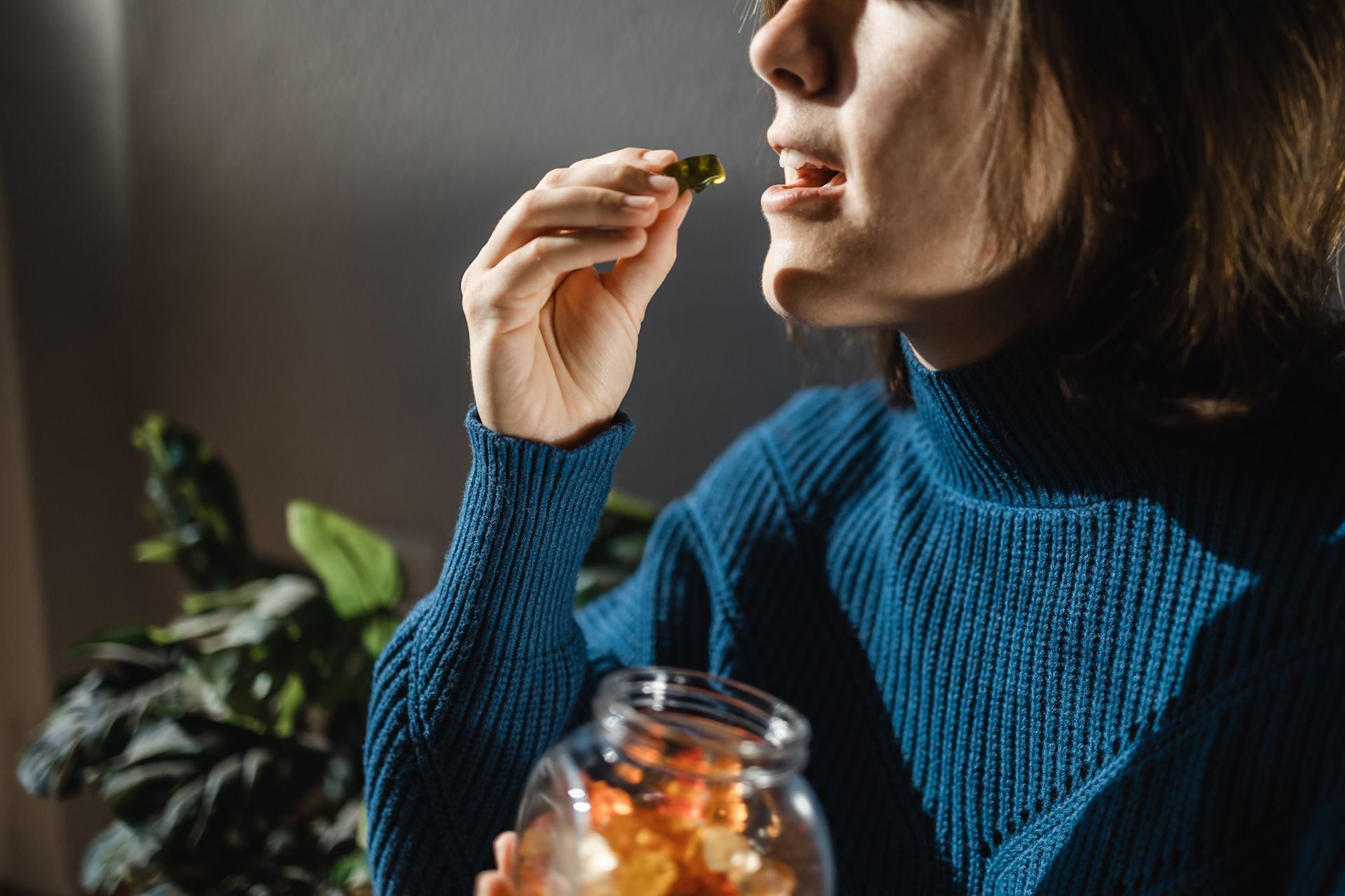 Woman eating edible weed sweet candy leaf 