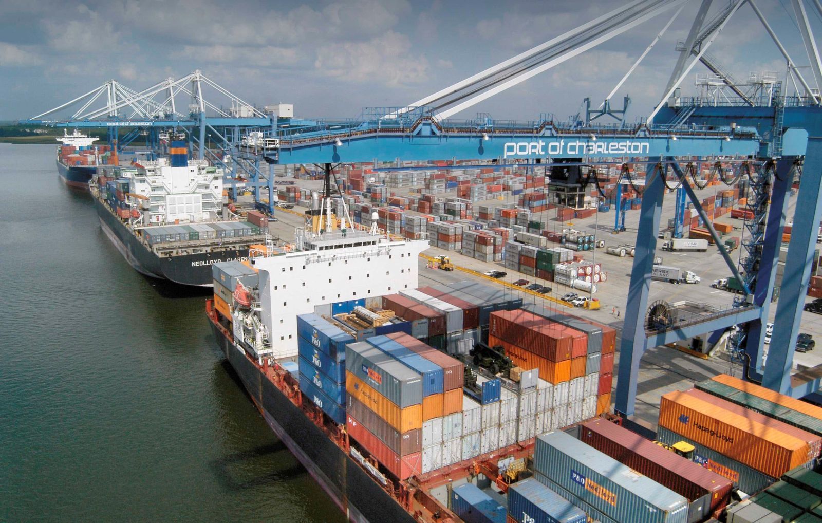 A large container ship is docked at a port.