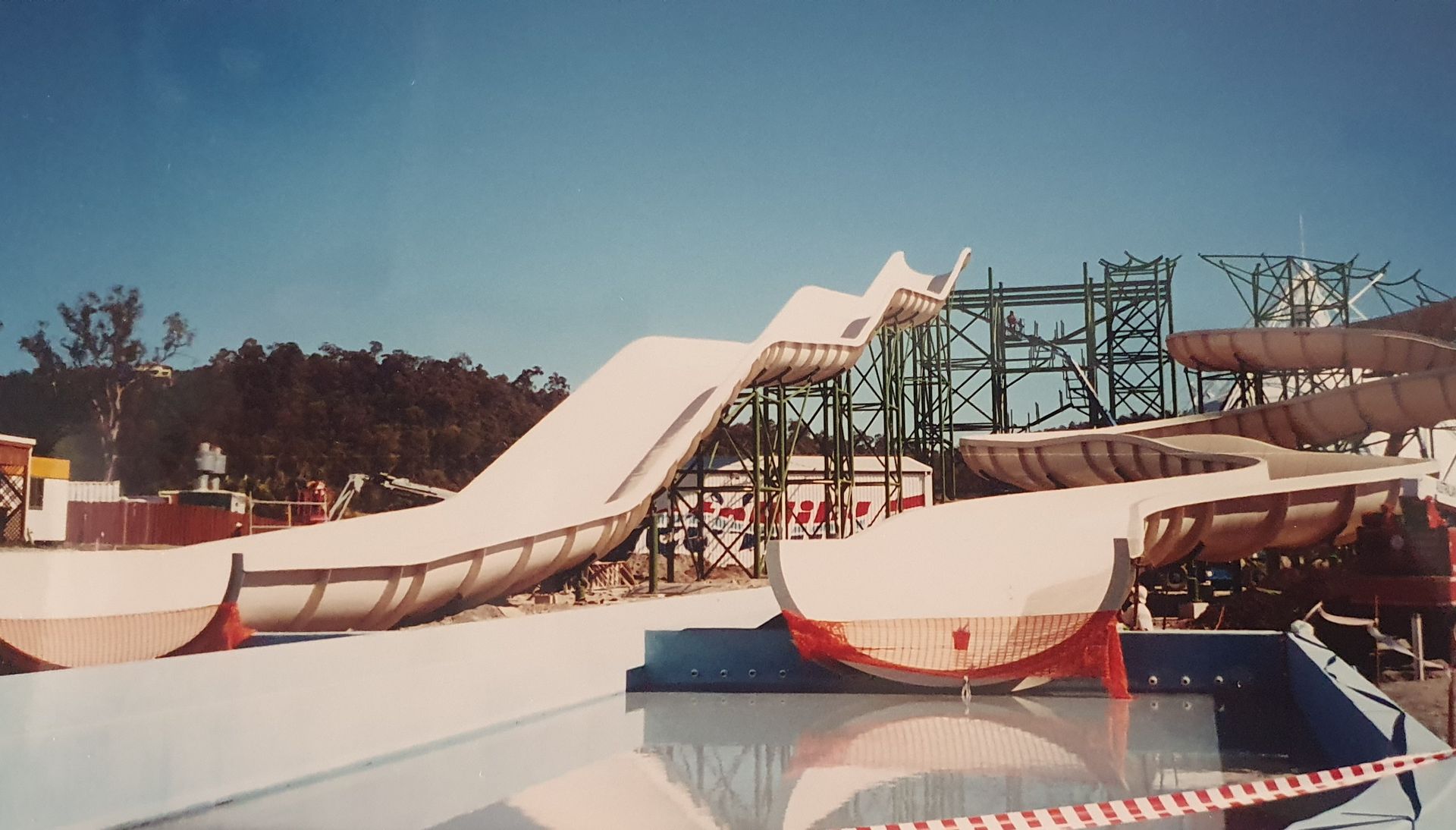 Water park with large white water slides against a blue sky — Darren Gray Cad Services In Upper Corindi, NSW