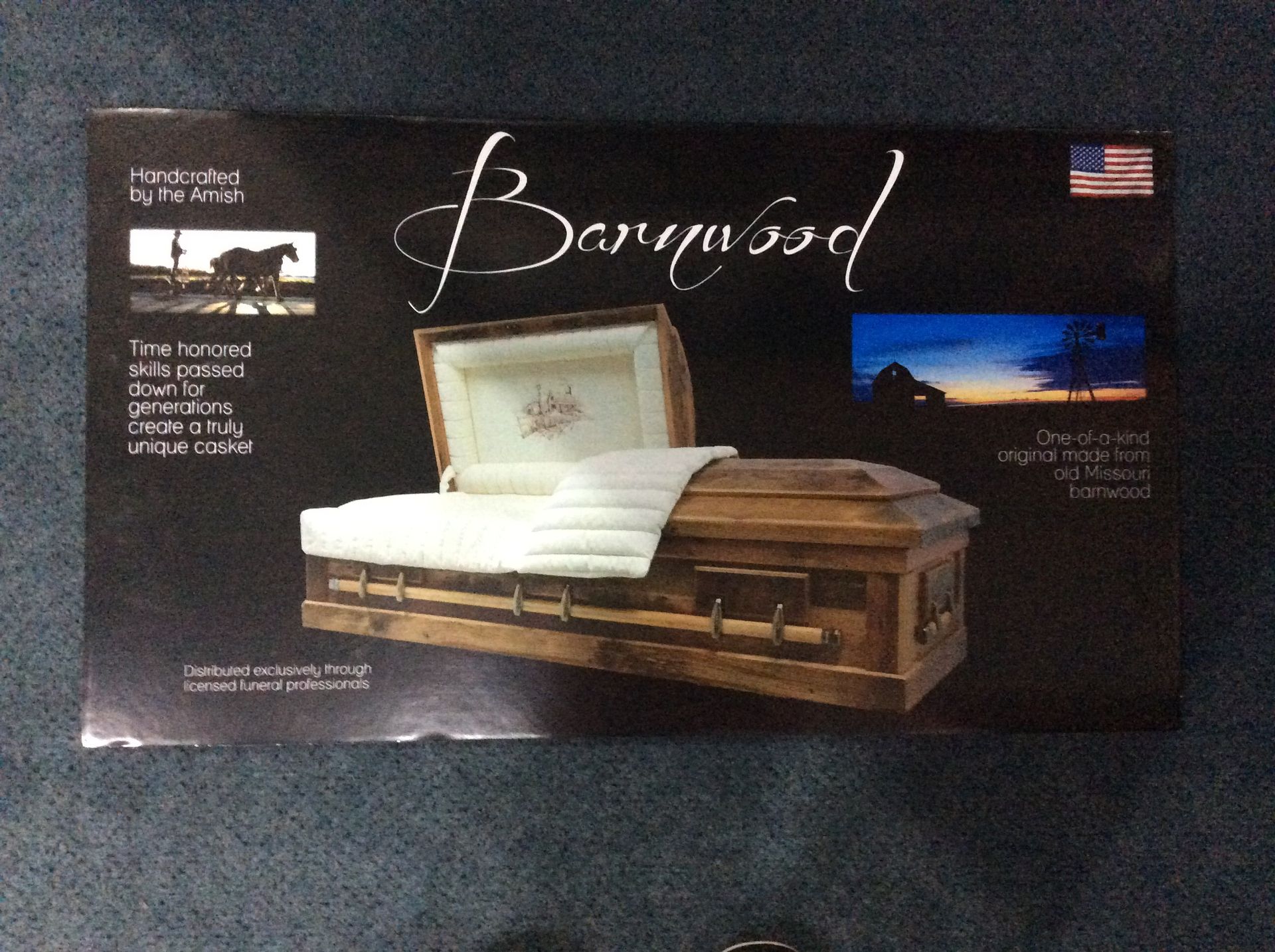 A coffin in a box that says barnwood on it