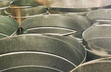 Metal ductwork, stacked, showing overlapping cylindrical SPIRO