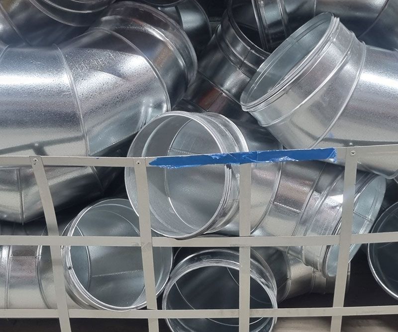 Metal ductwork fittings ready for installation.