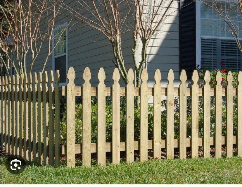 A wooden picket fence in front of a house  | Louisville, KY | Lancaster Fencing