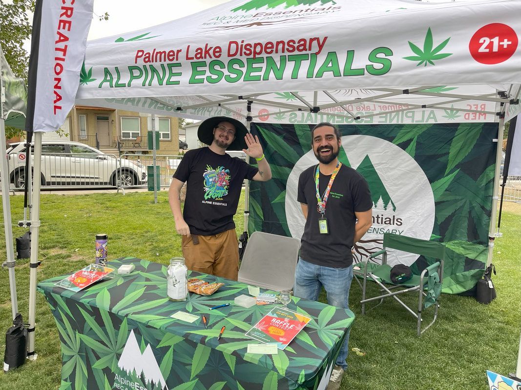 Two men at a cannabis dispensary booth, 
