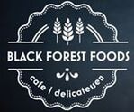 Logo for Black Forest Foods, a cafe and delicatessen. Features wheat stalks, a decorative border, and text.