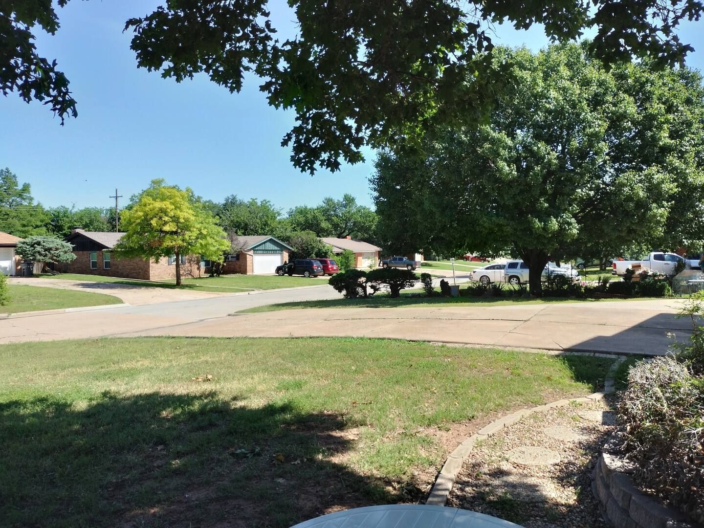 A residential area with a lot of trees and houses