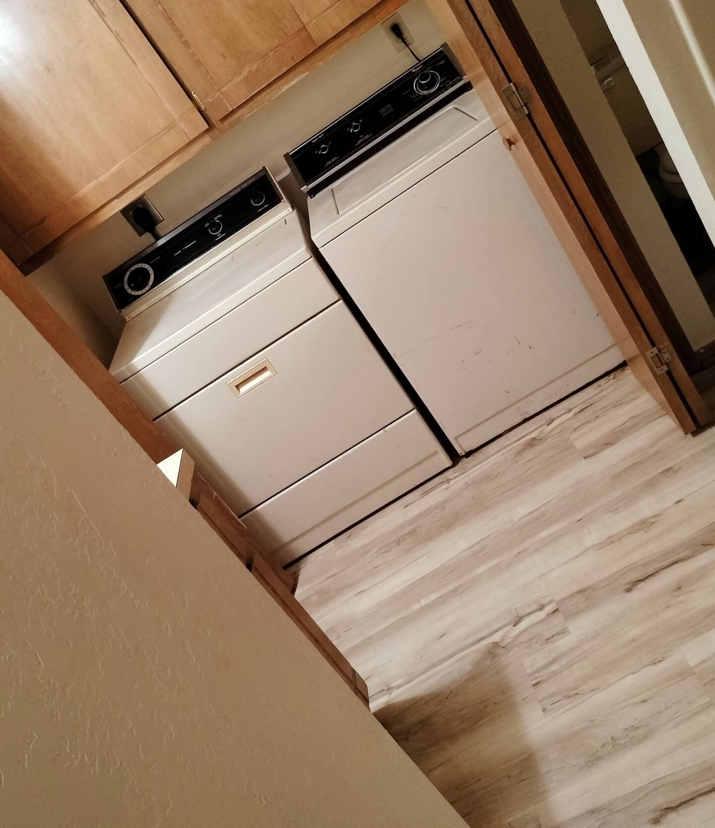 A laundry room with a washer and dryer in it
